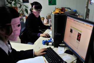 Illustration for article titled China's Radiation Masks Sure Make Computer Work Interesting